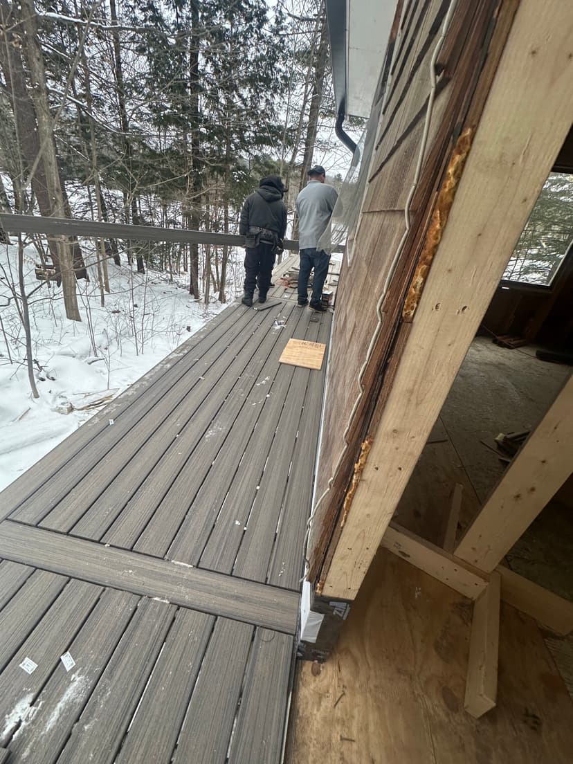 Vermont Custom Exteriors crew building a deck in winter